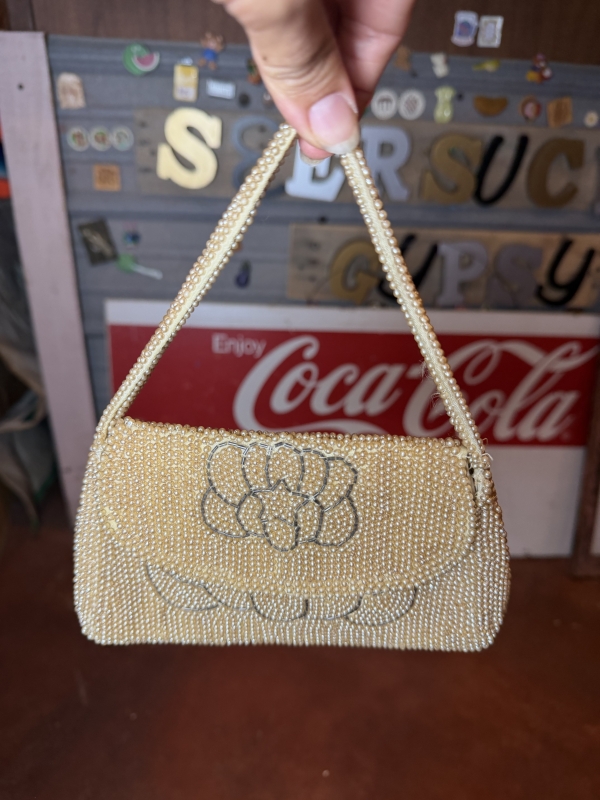 Handmade pearl clutch with star pattern 