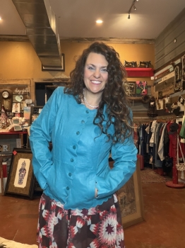 Turquoise leather jacket with scalloped trim