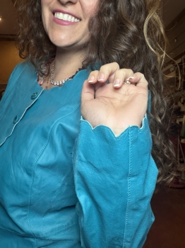 Turquoise leather jacket with scalloped trim