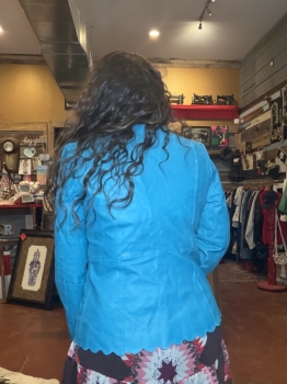 Turquoise leather jacket with scalloped trim
