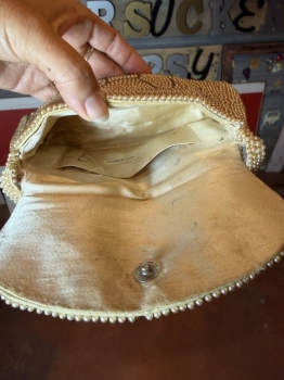 Handmade pearl clutch with star pattern 